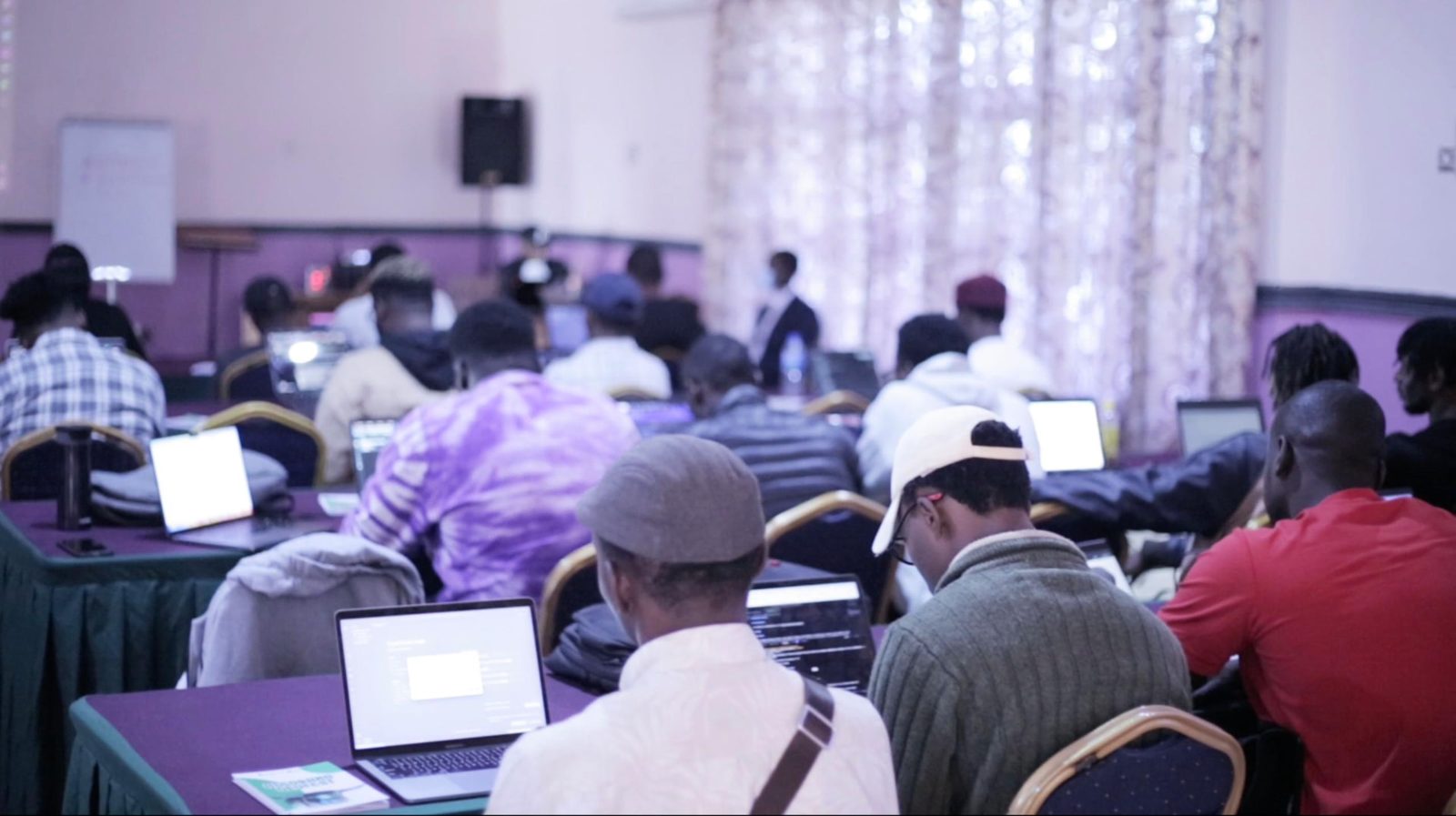 Training room full of learners at laptops