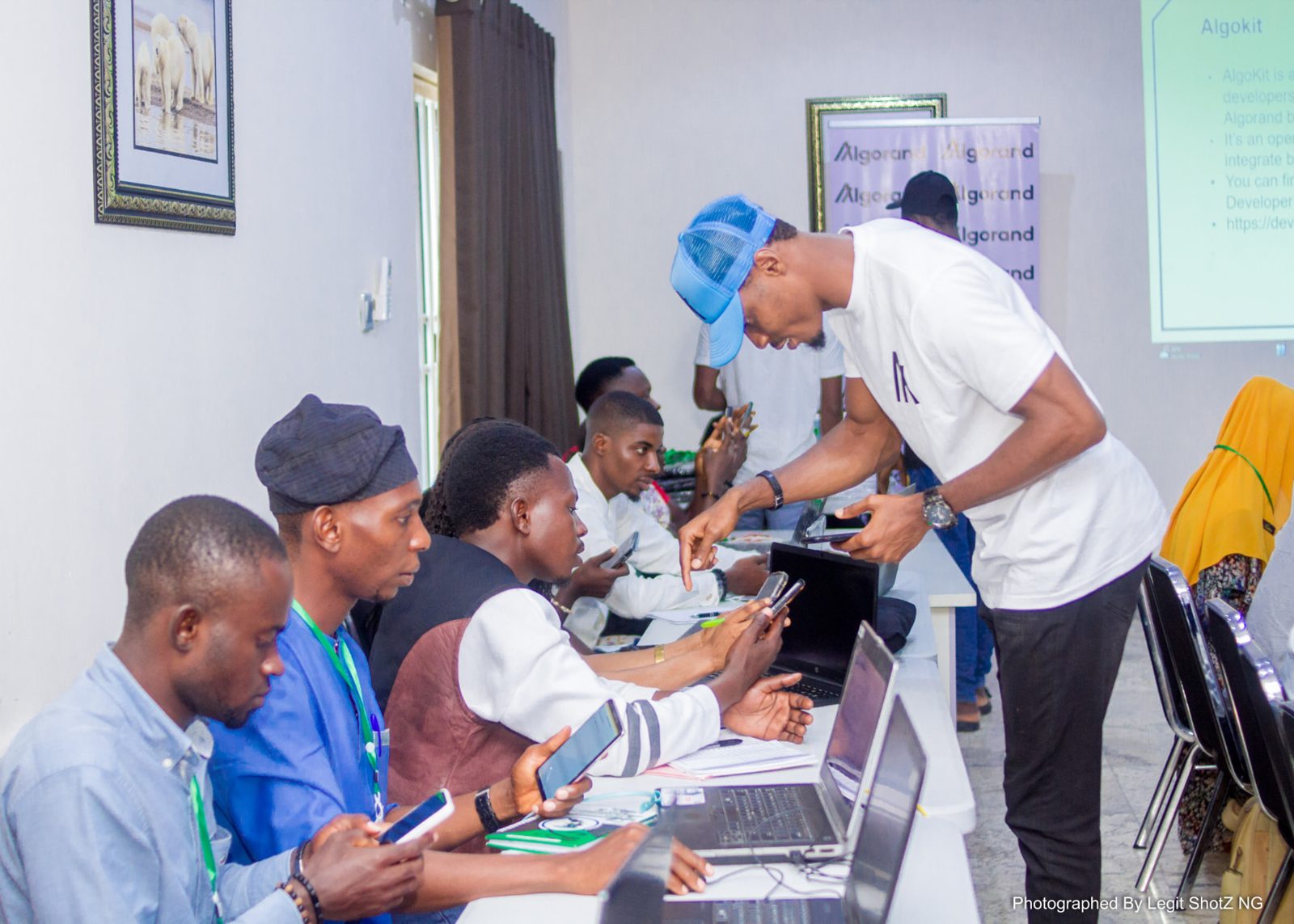 Mentor helping learners work through code