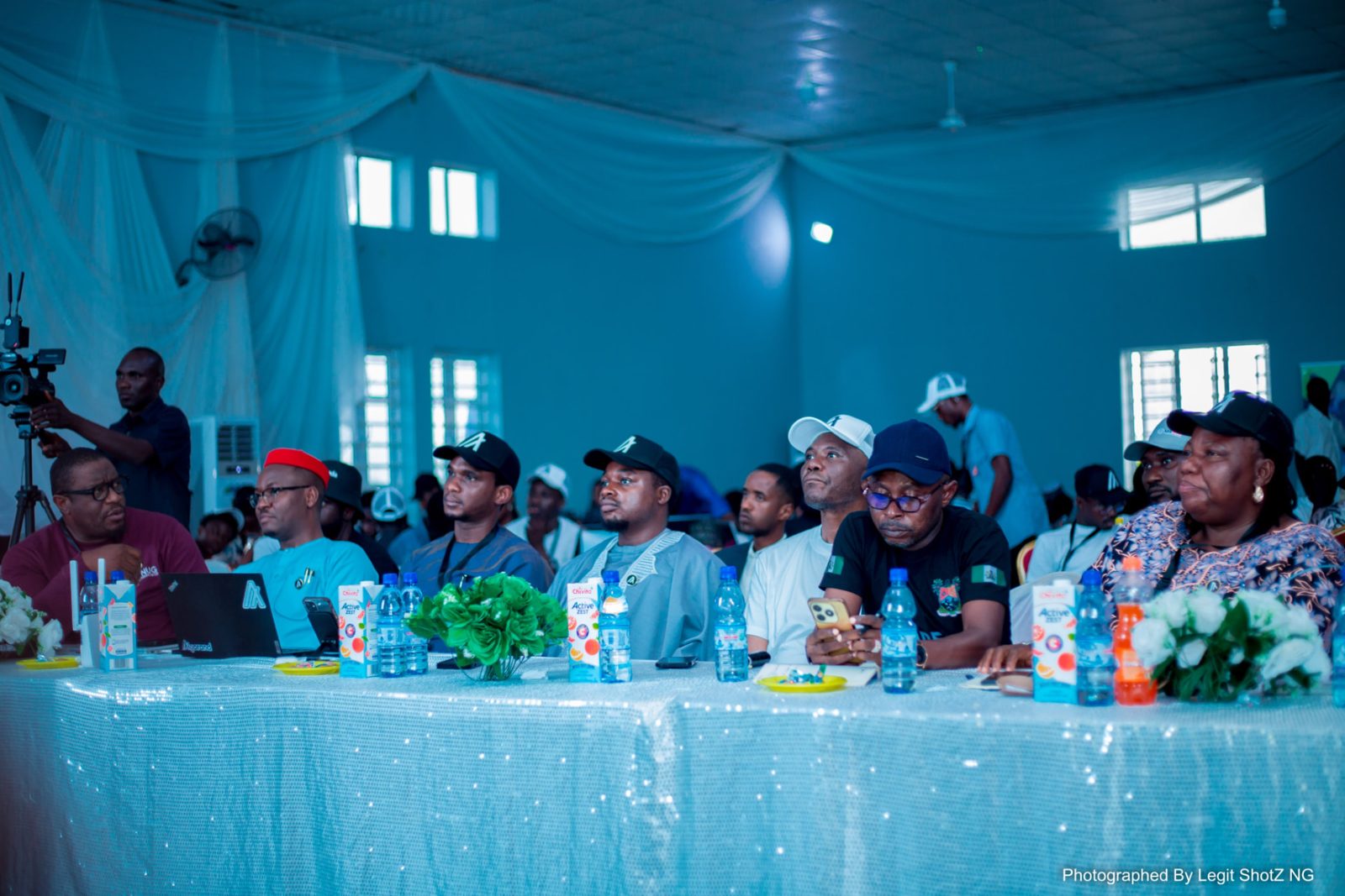 Judging panel and builders at a past community hackathon